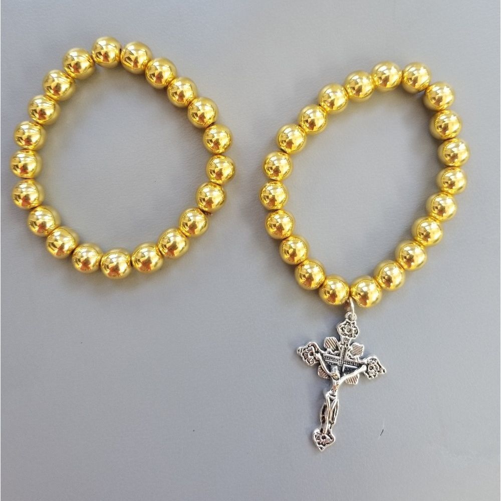 1 gold bracelet with cross charm